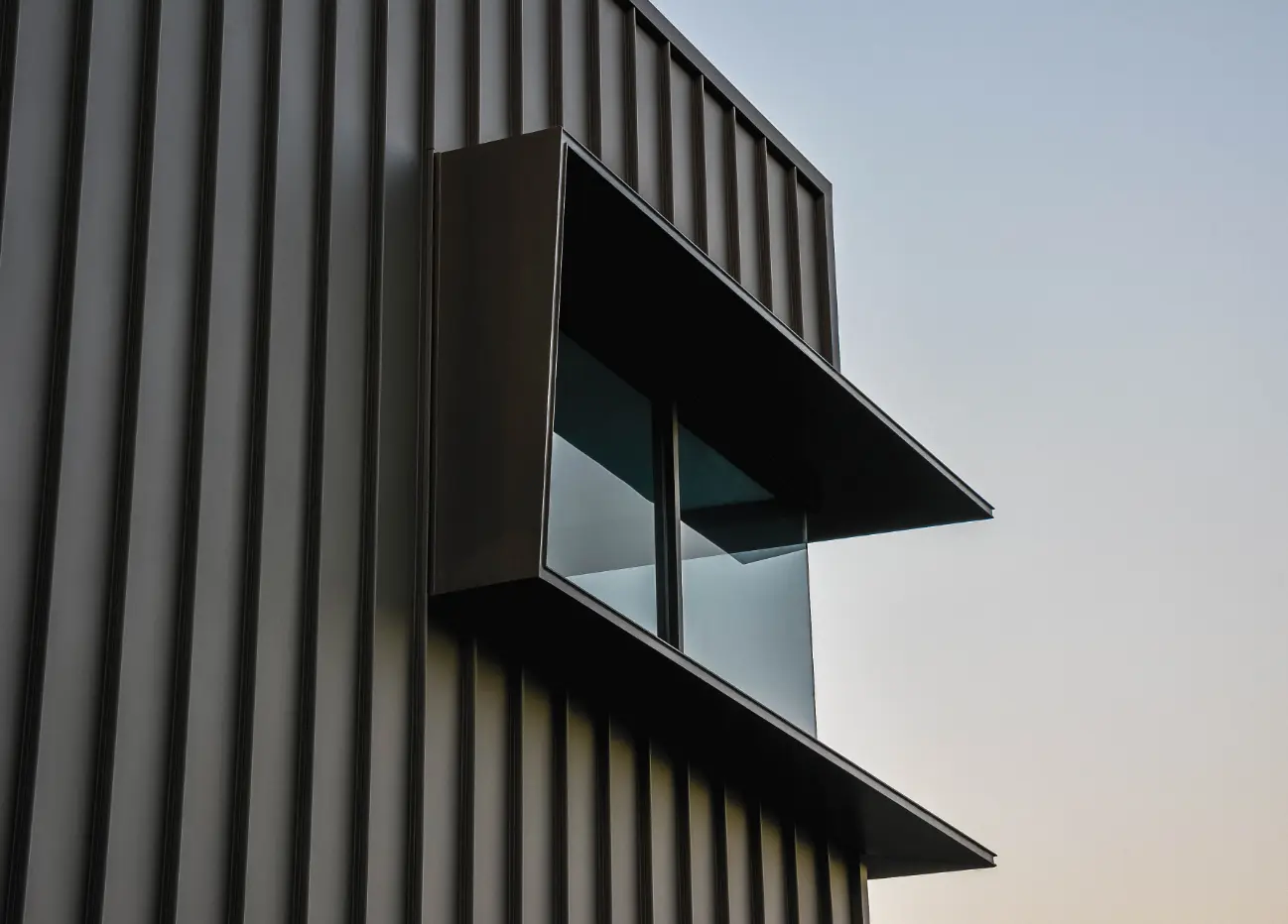 Window with corrugated metal exterior
